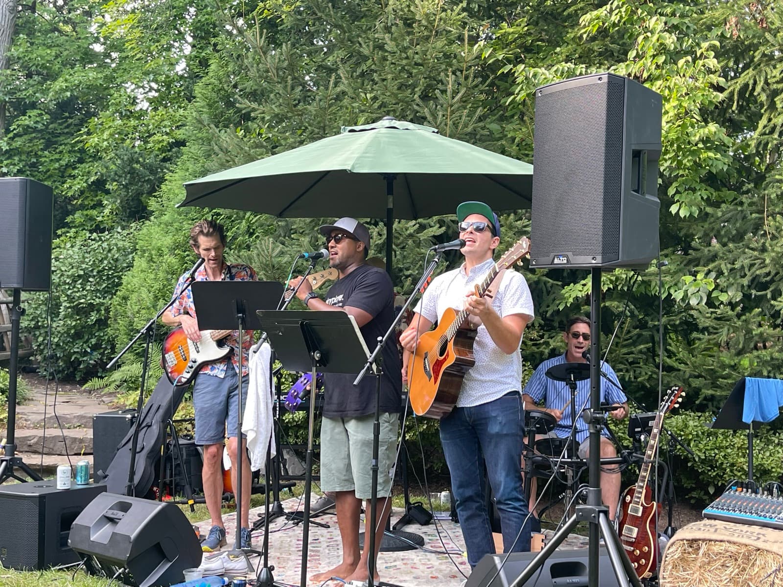 Water Towers playing a backyard garden gig